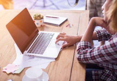 Hand control on a laptop touchpad Stock Photos