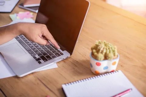 Hand control on a laptop touchpad Stock Photos