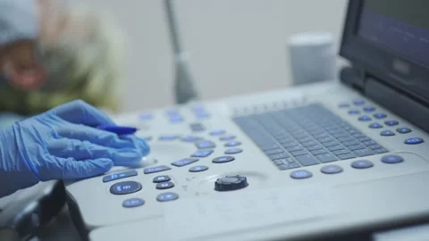Hand On Control Panel At Ultra Sound Scan On Monitor Stock Footage 154919003