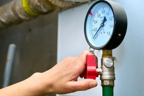 Hand controlled the water supply.Pressure sensor in basement Stock Photos