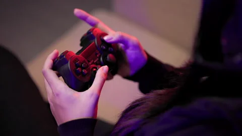 Hand with controller playing video game. Young asian pretty woman sitting. Stock Footage 175650127