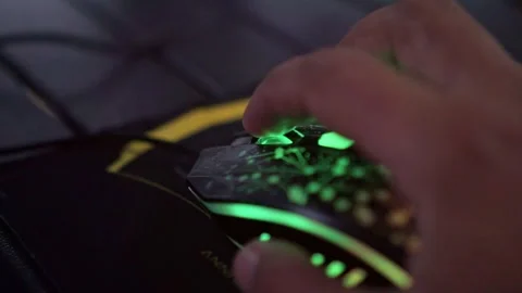 Hand controlling computer mouse with glowing lights, Stock Footage 334395285