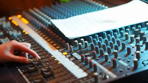 Hand controlling volume on cencert Stock Footage 76164588