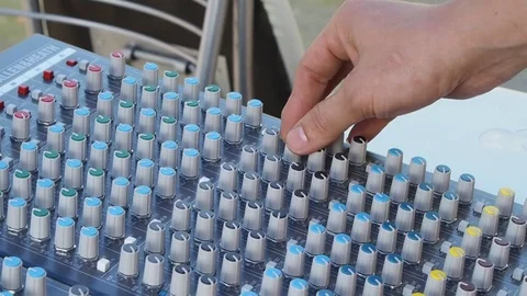 Hand controlling volume Stock Footage 76164449