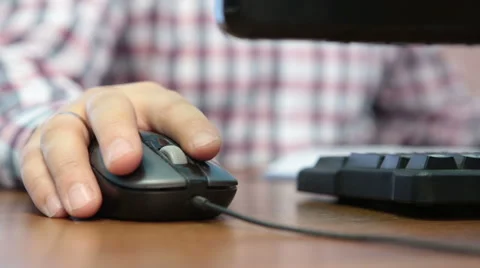 A hand controls computer mouse closeup Stock Footage 45392875