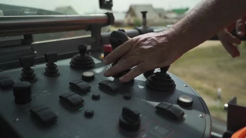 The hand controls the control panel of road milling machines in motion. closeup Stock Footage 145466050