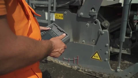 The hand controls the control panel of road milling machines in motion. closeup Vídeos de archivo 145466061