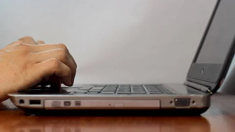 Hand controls laptop through touchpad Stock Footage 133250380