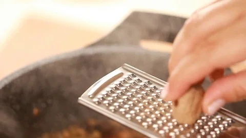 Hand cook grating nutmeg Majadrah – Lentils Middle Eastern cuisine Stock Footage 78666298