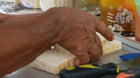 Hand cooking toast using spatula on grill Stock Footage 301599581