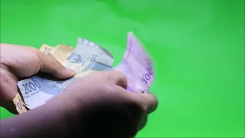 Hand count Realistic banknotes (Indonesian Rupiah) with nominal mix. HD Stock Footage 202867166