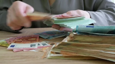 Hand counting big stack of euro money on wooden background. money cash, close Stock Footage 332795234