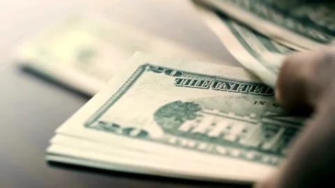 Hand Counting bundle of twenty dollar banknotes, close up. Dollar paper money Video stock 336264451