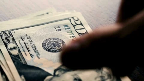 Hand Counting bundle of twenty dollar banknotes, close up. Dollar paper money Stock-Footage 336264587