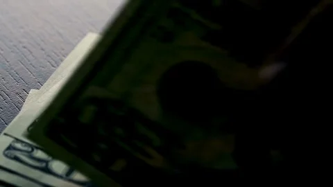 Hand Counting bundle of twenty dollar banknotes, close up. Dollar paper money Stock-Footage 336264601
