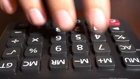 Hand counting on calculator Stock Footage 94935668