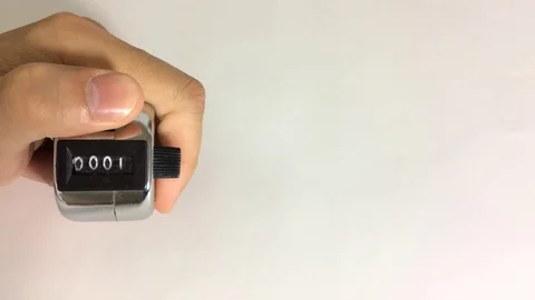 Hand counting clicker  0 to 20 Stock Footage 125724784