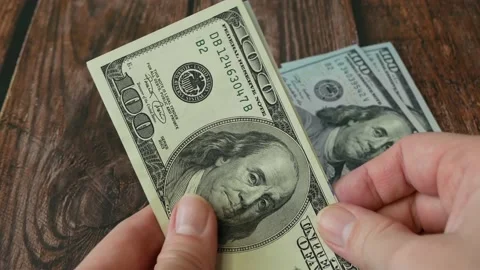 Hand counting  dollar usa old and new banknotes on wooden background Video stock 211807224