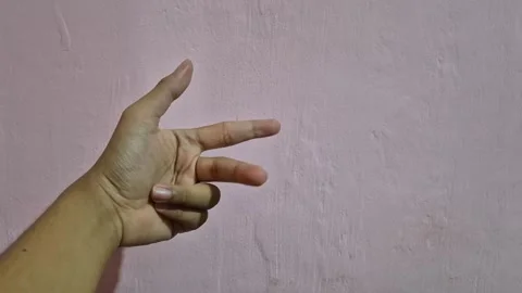 Hand counting down from 5 to 0 by closing fingers sequentially Stock Footage 337058009