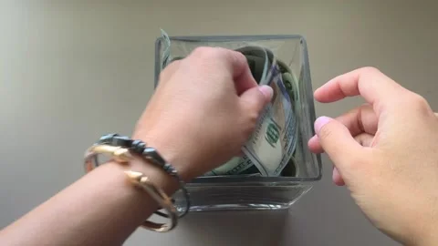 Hand Counting Money From Jar Stock Footage 132550876