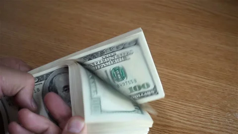 Hand counting of one hundred dollar bills Stock Footage 140255710