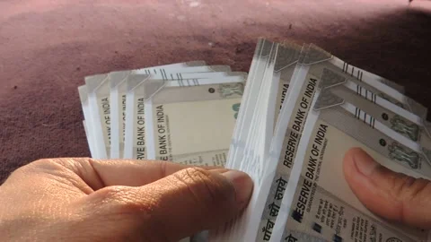 Hand counting sorting calculate indian 500 rupees bank notes cash paper currency Stock-Footage 138799777