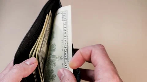 Hand counts 100 dollar bills in wallet. The concept of payment, investment, shop Stock Footage 221647401