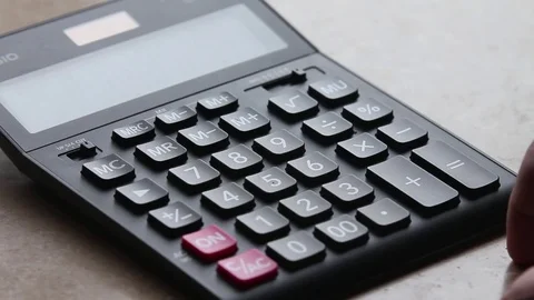 Hand counts on the calculator with a stop Stock Footage 85186116