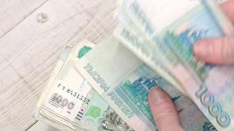 Hand counts a stack of thousand ruble banknotes. Stock Footage 345166143