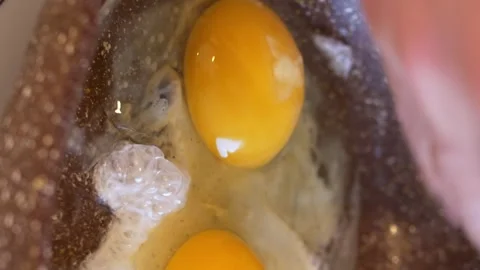 Hand cracking egg frying pan, home cooking. home cuisine, skillful act breaking Stock Footage 258933947