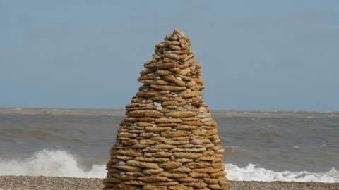 Hand crafted Cairn visually impresive Thorpeness landmark Stock Footage 196741541