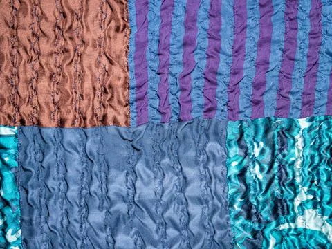 Hand-crafted detail of blue patchwork fabric Stock Photos