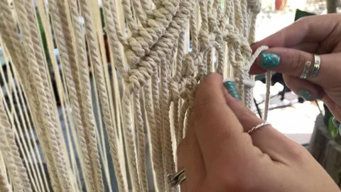 Hand crafting a Macrame chandelier Stock Footage 197511119