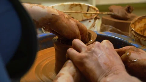Hand Crafting Pottery. Traditional techniques of creating pots. Potter hands wor Video stock 99772322