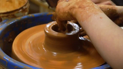 Hand Crafting Pottery. Traditional techniques of creating pots. Potter hands wor Stock Footage 99773465