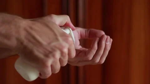Hand cream dropping on man's hands Stock Footage 64623711