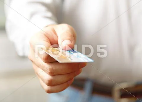 Hand with credit card. shallow dof Stock Photos