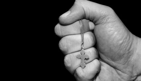 Hand with a cross Foto stock