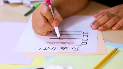 Hand Crossing Off Homework on To-Do List with Marker Vídeos de archivo 321379894