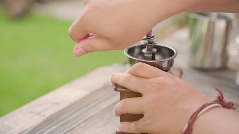 Hand crushing beans with coffee grinder Video stock 94209398