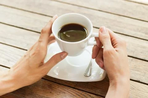 Hand with cup of coffee Stock Photos