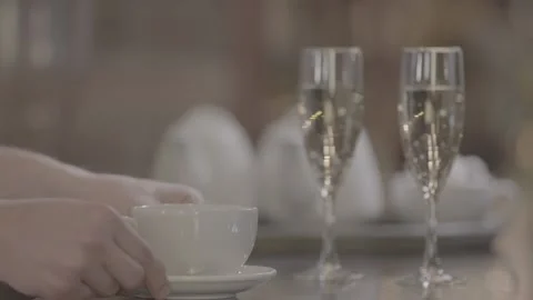 Hand with a Cup of tea in the restaurant Slow motion Stock Footage 239375738
