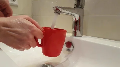 Hand cup water tap Stock Footage 87945366