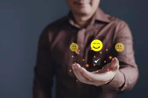 Hand of customer or client holding smile face to complete five stars with c.. Stock Photos