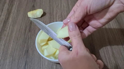 Hand cut apple Stock-Footage 152650145