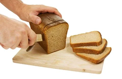 Hand cut rye bread on a board Foto stock