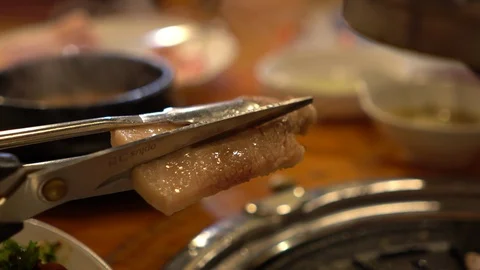 Hand cut slice of bbq pork Stock Footage 102537457