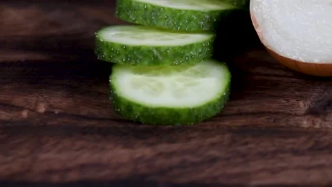 Hand Cuts Cucumber Rings CloseUp. 스톡 동영상 166141098