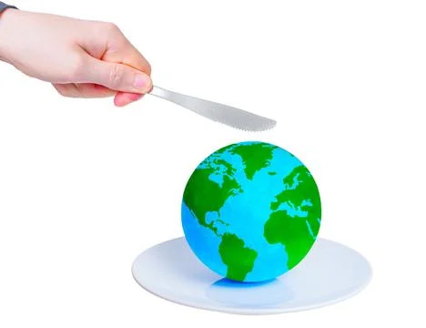 Hand Cuts a Globe with a Knife Foto stock