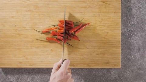 Hand cuts red hot pepper. Stock Footage 117520089